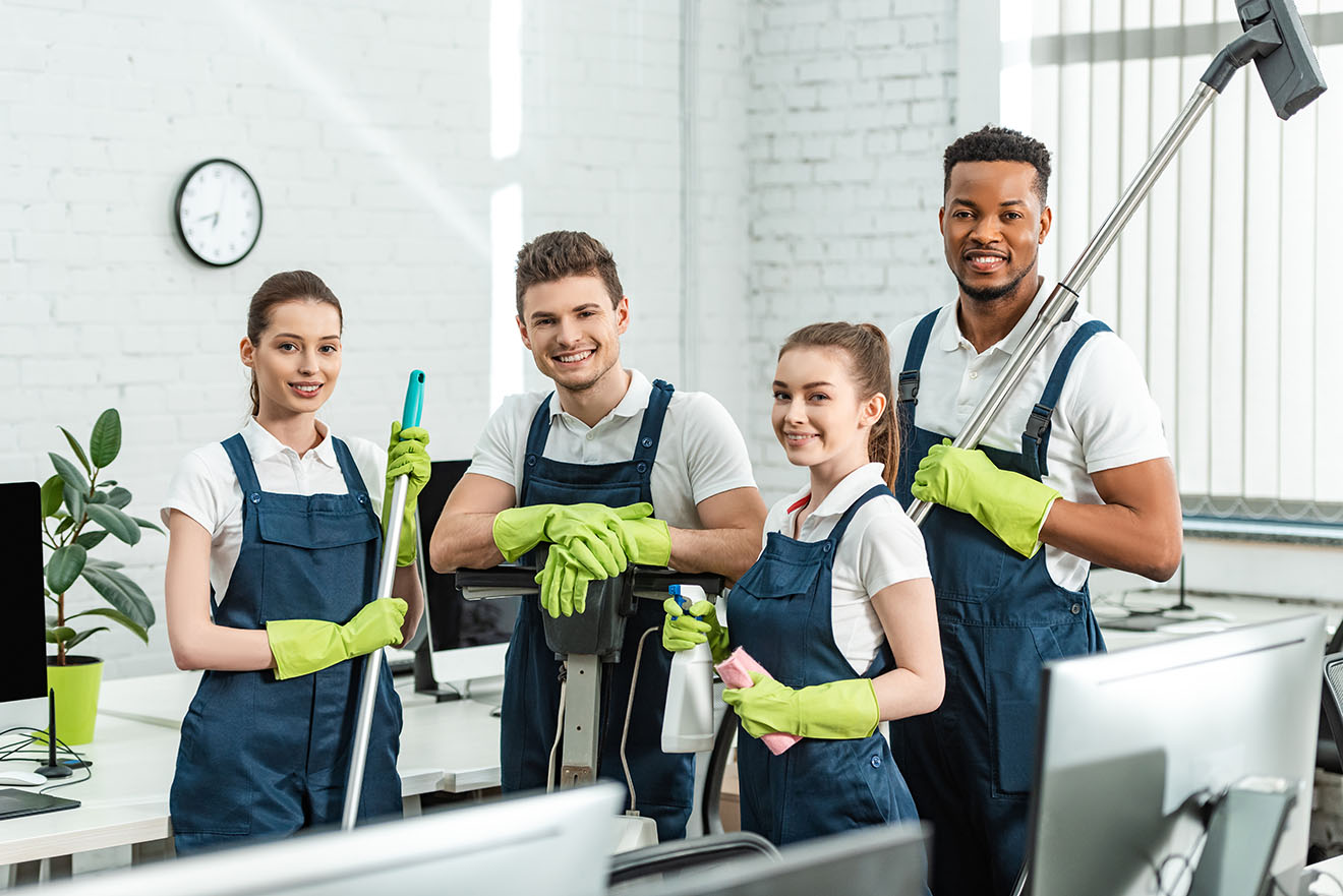 happy-multicultural-cleaners-looking-at-camera-whi-2021-09-03-16-53-46-utc-1.jpg